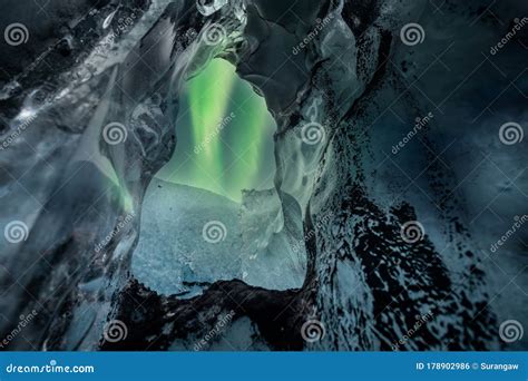 Northern Lights Aurora Borealis Over Glacier Ice Cave. Stock Photo ...