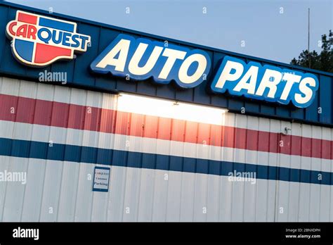 A logo sign outside of a Carquest Auto Parts retail store location in ...