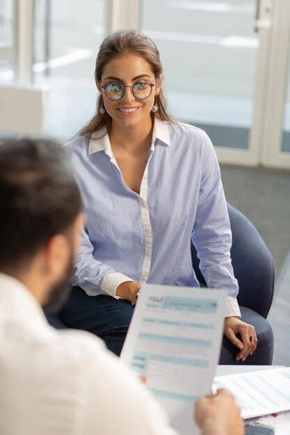 Premium Photo Cheerful Brunette Female Person Answering On Questions