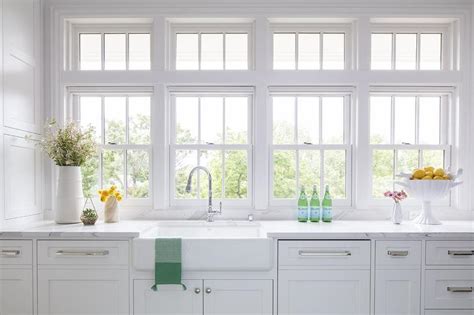 Band Of Windows Over Farmhouse Sink With Gooseneck Faucet