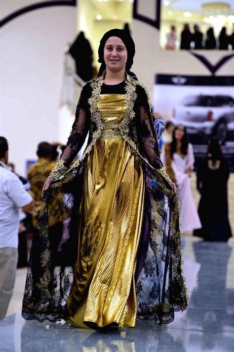 Models present traditional Yemeni clothes in a fashion show held in Sanaa