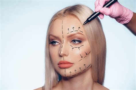 Premium Photo Beautiful Blonde Woman With Markings For Plastic Surgery On Her Face