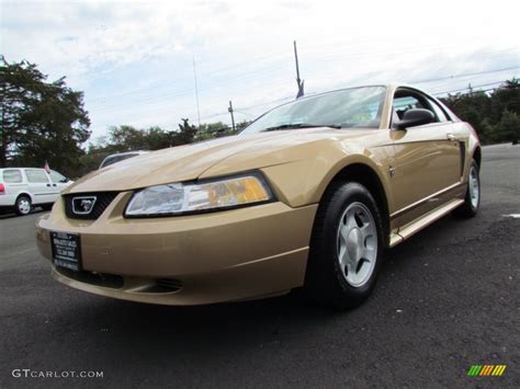 2000 Sunburst Gold Metallic Ford Mustang V6 Coupe 72204302 Gtcarlot