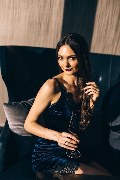 Premium Photo Sexy Brunette In A Restaurant With Wine