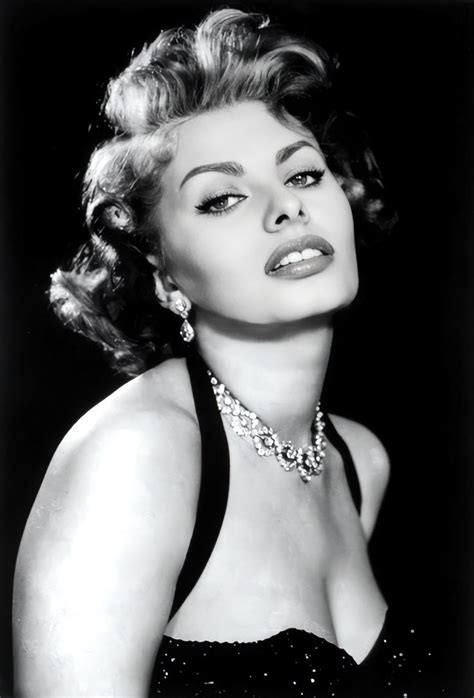 An Old Black And White Photo Of A Woman In A Dress With Pearls On Her Neck