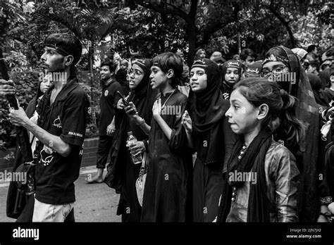 Bangladeshi Shia Muslims March And Carry The Flags And Tazia During A