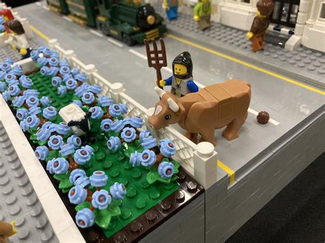 Went to a Lego show. My farm animals invaded the display next to them 🐑🐄💩 : r/lego