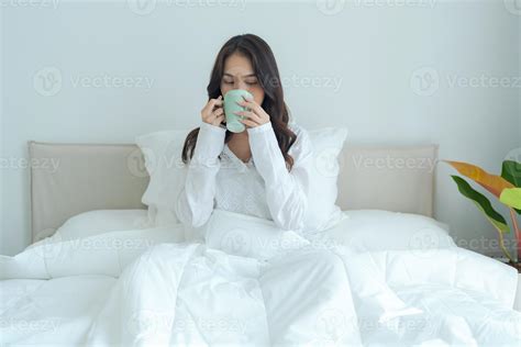 Beautiful Girl Sitting And Drinking Hot Tea In The Morning Stock Photo At Vecteezy