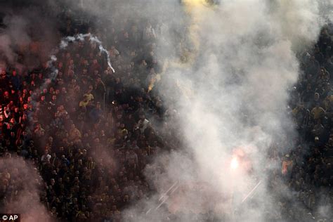 Olympiacos' quarter-final with AEK abandoned after an 89th minute goal sparks more crowd trouble ...