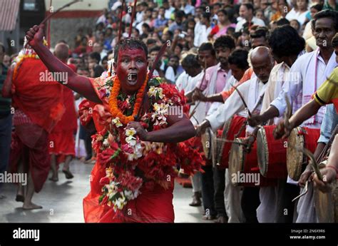 A Hindu Priest Face Smeared With Color And Sacrificial Blood Performs