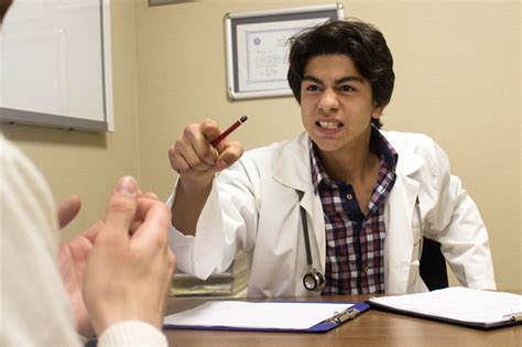 Furious Male Doctor Screaming Patient Stock Photo Download Image Now