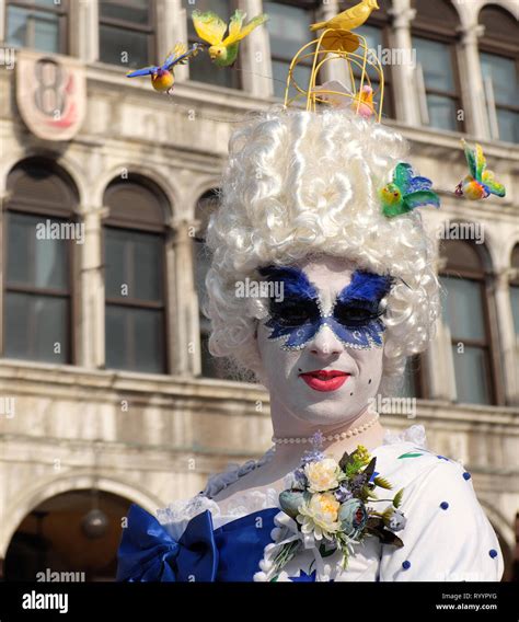 Man Dressed As Woman Traditional Mask And Costume For Venice Carnival