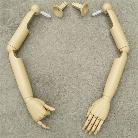 These Articulated Arms Are Made Of Plastic With A Wood Ingrain Look