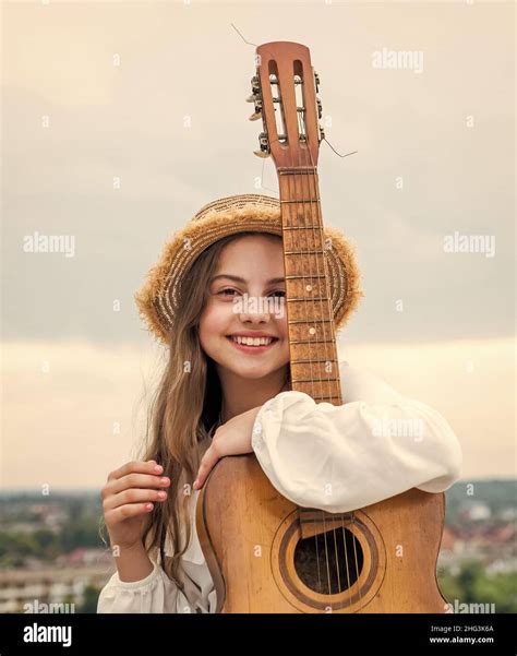 Stylish Child Girl Playing Guitar Outdoor Country Music Stock Photo