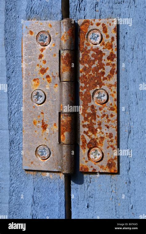 Rusting Hinge On Blue Wooden Door Stock Photo Alamy