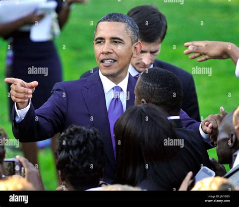 United States President Barack Obama Points As He Shakes Hands After Delivering Remarks To Ncaa