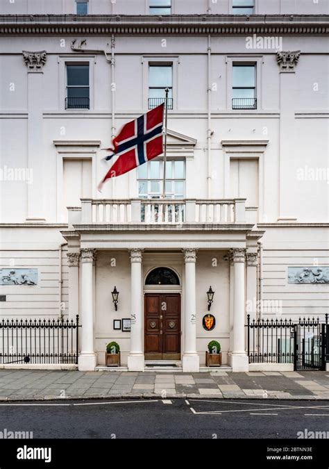 Embassy of Norway, London, UK. The national flag flying over the entrance and façade Norwegian ...