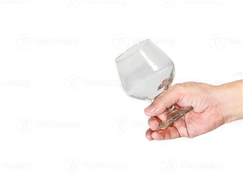 Hand holding empty brandy glass on background 10713945 Stock Photo at ...