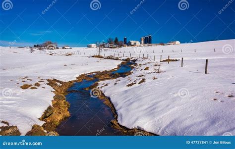 Stream Through A Snow Covered Farm Field In Rural Lancaster County