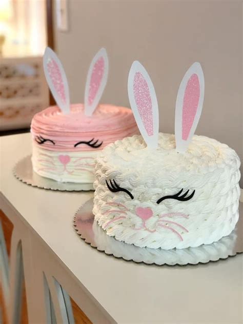 Two Cakes Decorated To Look Like Bunnies With Bunny Ears