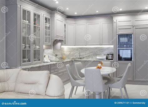 Modern Beige And Grey Colored Kitchen Interior In Classic Style With