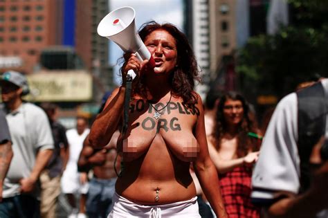 Women Bare Their Naked Breasts As They Participate In The Gotopless