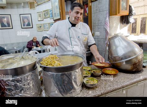 Hashem Restaurant, downtown Amman, Jordan. Fuul, Falafel and Hummus being prepared at the ...