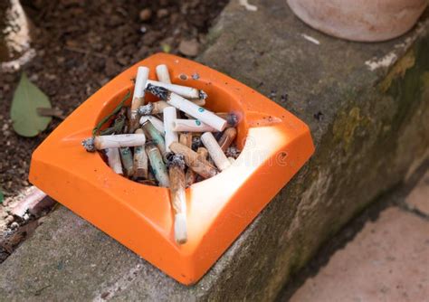 Hand Putting The Cigarette On An Ashtray Stock Photo Image Of Table