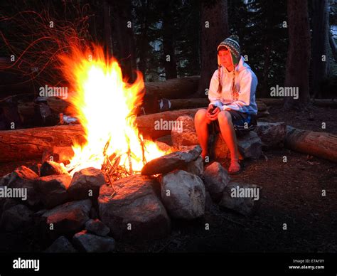 Woman Sitting Campfire Hi Res Stock Photography And Images Alamy