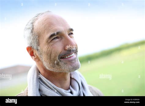 Portrait Of Smiling Mature Handsome Guy Stock Photo Alamy