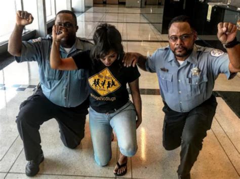 Two Black Police Officers Reprimanded For Taking A Knee With Activist