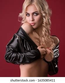 Стоковая фотография Naked Woman Leather Jacket On Red Shutterstock