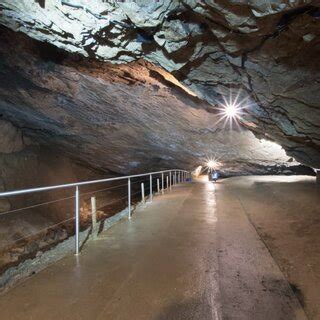 (a) Karst shapes, artificial concrete, and metal elements in the cave ...