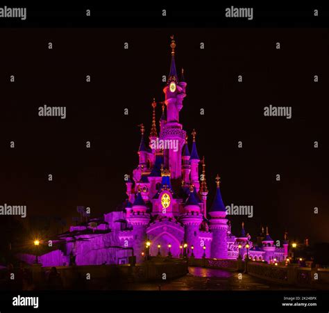 A Picture Of The Sleeping Beauty Castle Of Disneyland Paris At Night