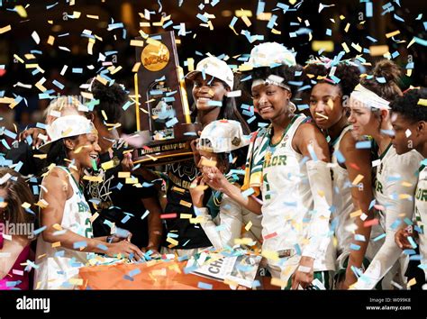 The Baylor Lady Bears Celebrate With The Championship Trophy After