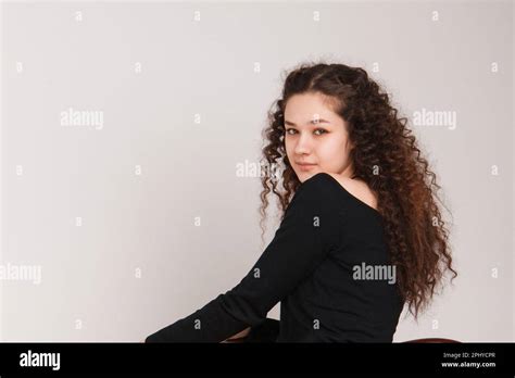 Fashion Female Portrait Smiling Curly Brunette Girl Posing Beautifully At The Camera On A White