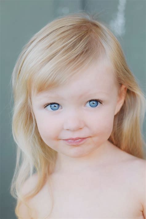 Baby With Blonde Hair And Blue Eyes