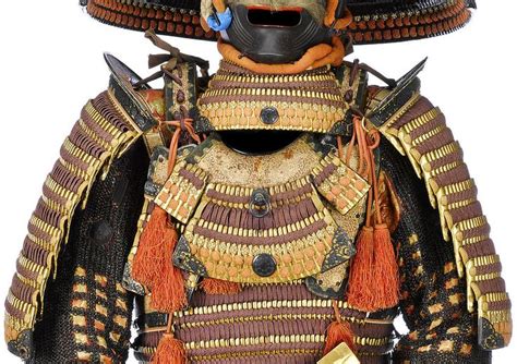 An Elaborately Decorated Japanese Armor And Helmet Is Displayed On A