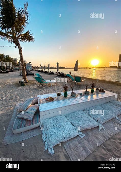 Dubai beach during sunset Stock Photo - Alamy