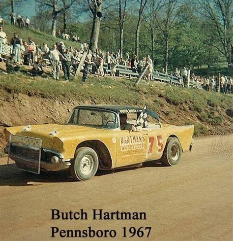 Butch Harman Racing In An Old Yellow Car