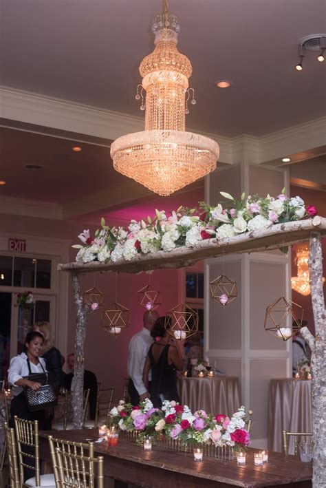 Flower Arch And Chandelier Decor For A Hot Pink Wedding