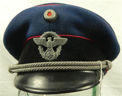 A WWII German Police Peaked Cap - Theodore Bruce | Find Lots Online