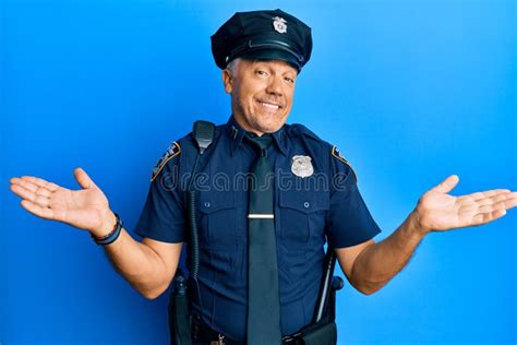 Handsome Middle Age Mature Man Wearing Police Uniform Smiling Showing Both Hands Open Palms