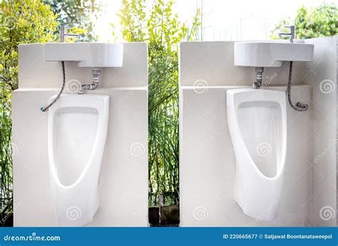 Urinals For Men To Urinate And Hand Washing Point In The Male Toilet At