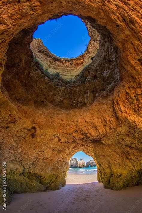 Famous caves in a beach rock formation in the Algarve, Portugal ...