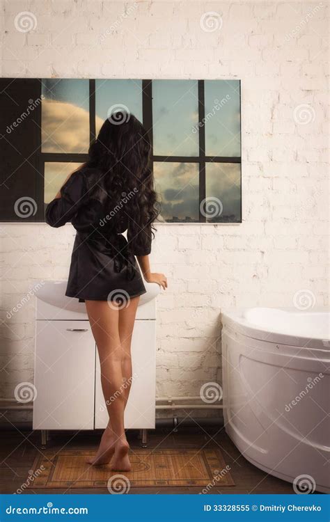 Beautiful Brunette Woman In The Bathroom Royalty Free Stock Photo