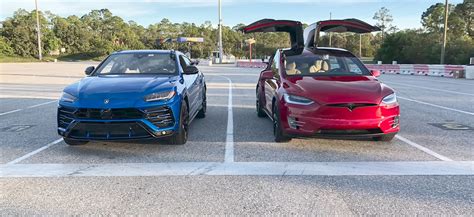 War Of The Worlds Tesla Model X P D Vs Lamborghini Urus Drag Race