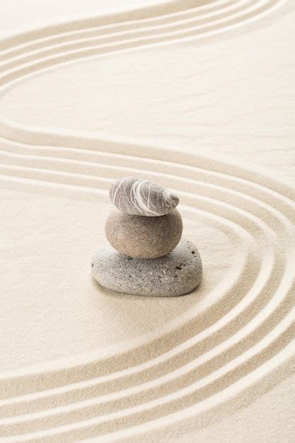 Premium Photo Japanese Zen Garden With Stacked Stones In Raked Sand