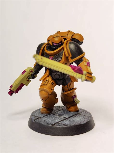 An Orange Space Marine Rminipainting