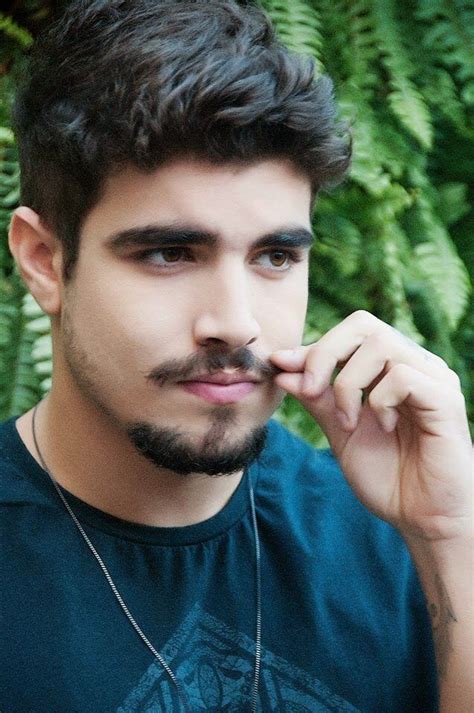 A Close Up Of A Person Wearing A Necklace And A Shirt With Plants In